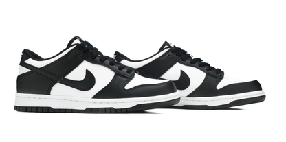 angled view picture of the nike dunk low white black gs