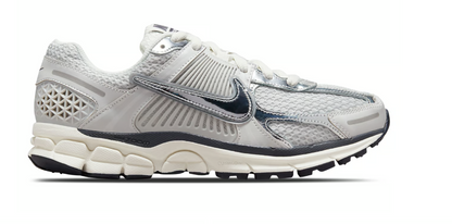 stock image of nike zoom vomero 5 photon dust trainers